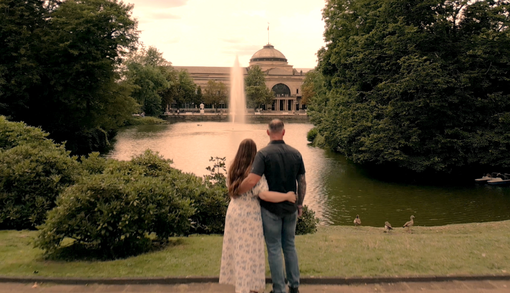 SFC Jason Snow and his wife in a park in Wiesbaden, Germany, as they film his Warrior Diary Video (WDV) in anticipation of his Administrative Separation Board at Fort Moore, Georgia. Military Lawyer, Administrative Separation Board Lawyer and The Warrior Advocate, Will M. Helixon, founder of the Law Office of Will M. Helixon and leader of the Warrior Law Team, successfully retained the Army Ranger from the 75th Ranger Regiment, who served at Landstuhl Regional Medical Center (LRMC) Germany, in a Separation Board at Fort Moore, Georgia.