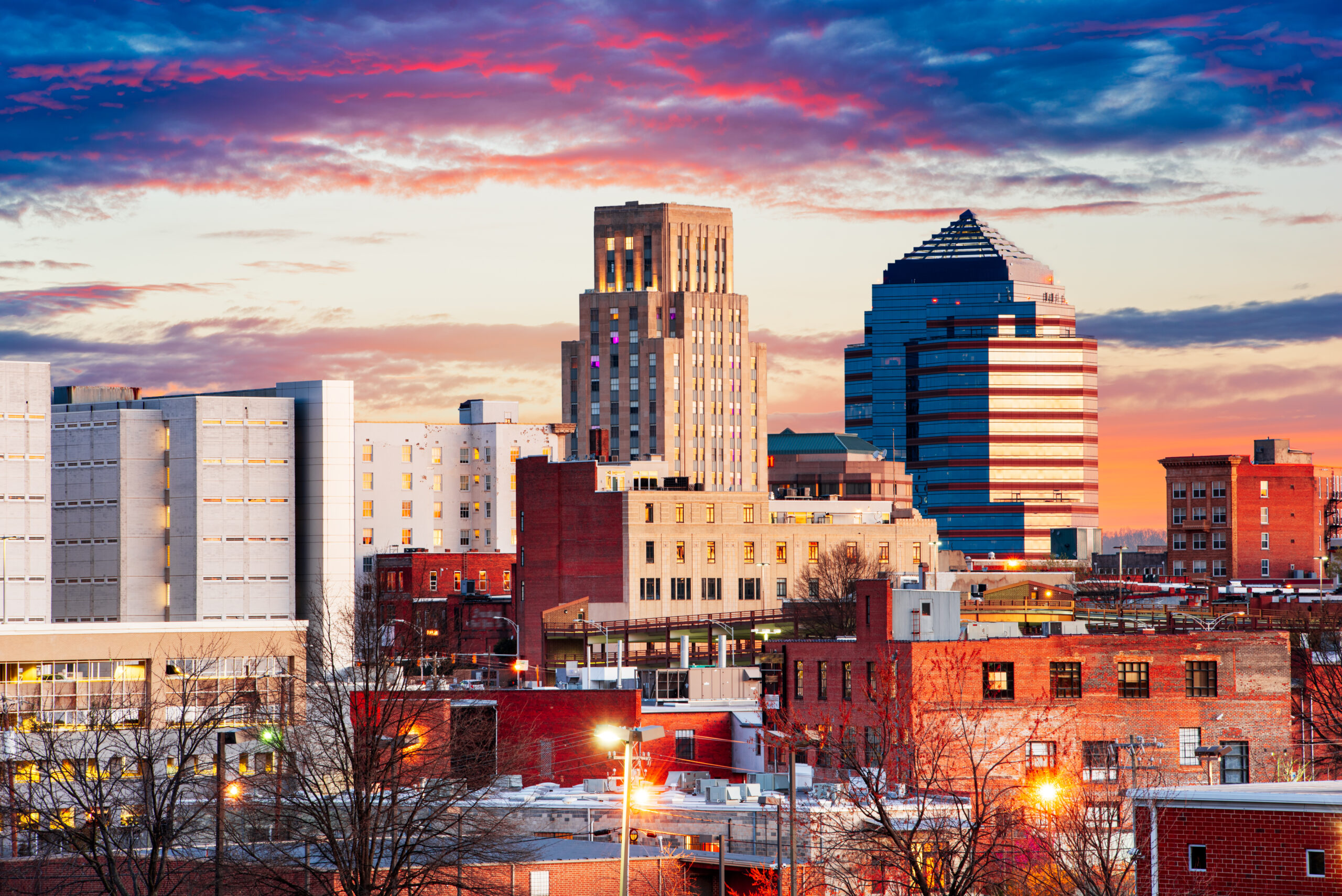 Downtown Durham, North Carolina skyline at sunset. Military Lawyers at Fort Bragg from The Law Office of Will M. Helixon, ready to assist with court-martial defense strategies.