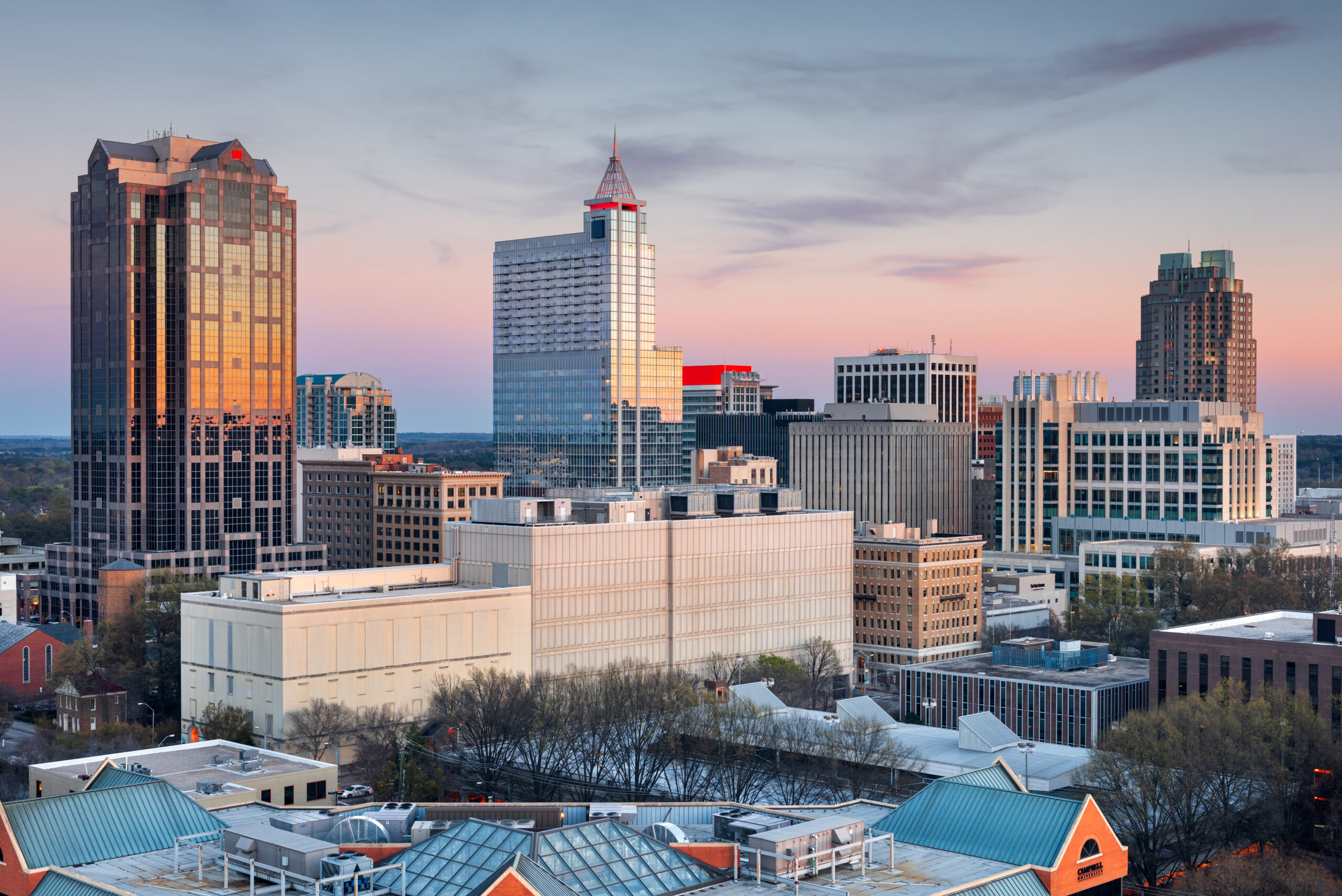 Skyline of downtown Raleigh, North Carolina at sunset. Military Lawyers at Fort Bragg from The Law Office of Will M. Helixon, ready to assist with court-martial defense strategies.