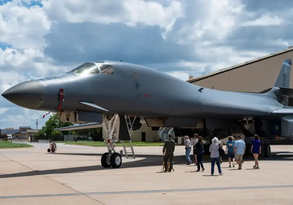 Visitors touring a B-1B Lancer strategic bomber on the flight line at Dyess Air Force Base in Texas
