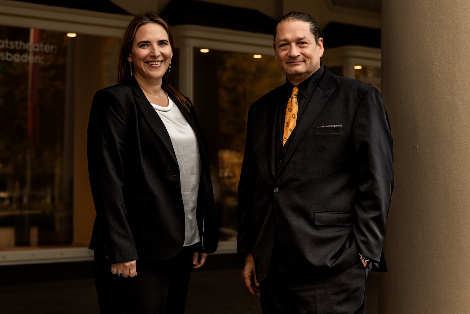 Elizabeth Talarico standing beside Will M. Helixon, both wearing dark suits
