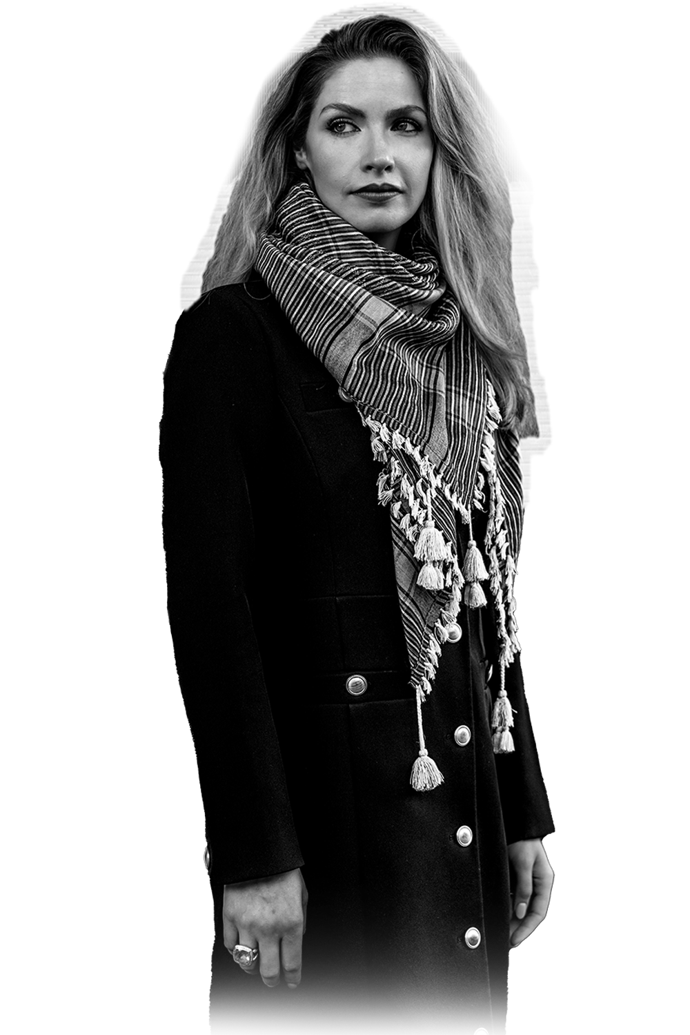 Black and white portrait of Laura Kiker in a dark coat and striped scarf, cut out on white background with faded lower edge