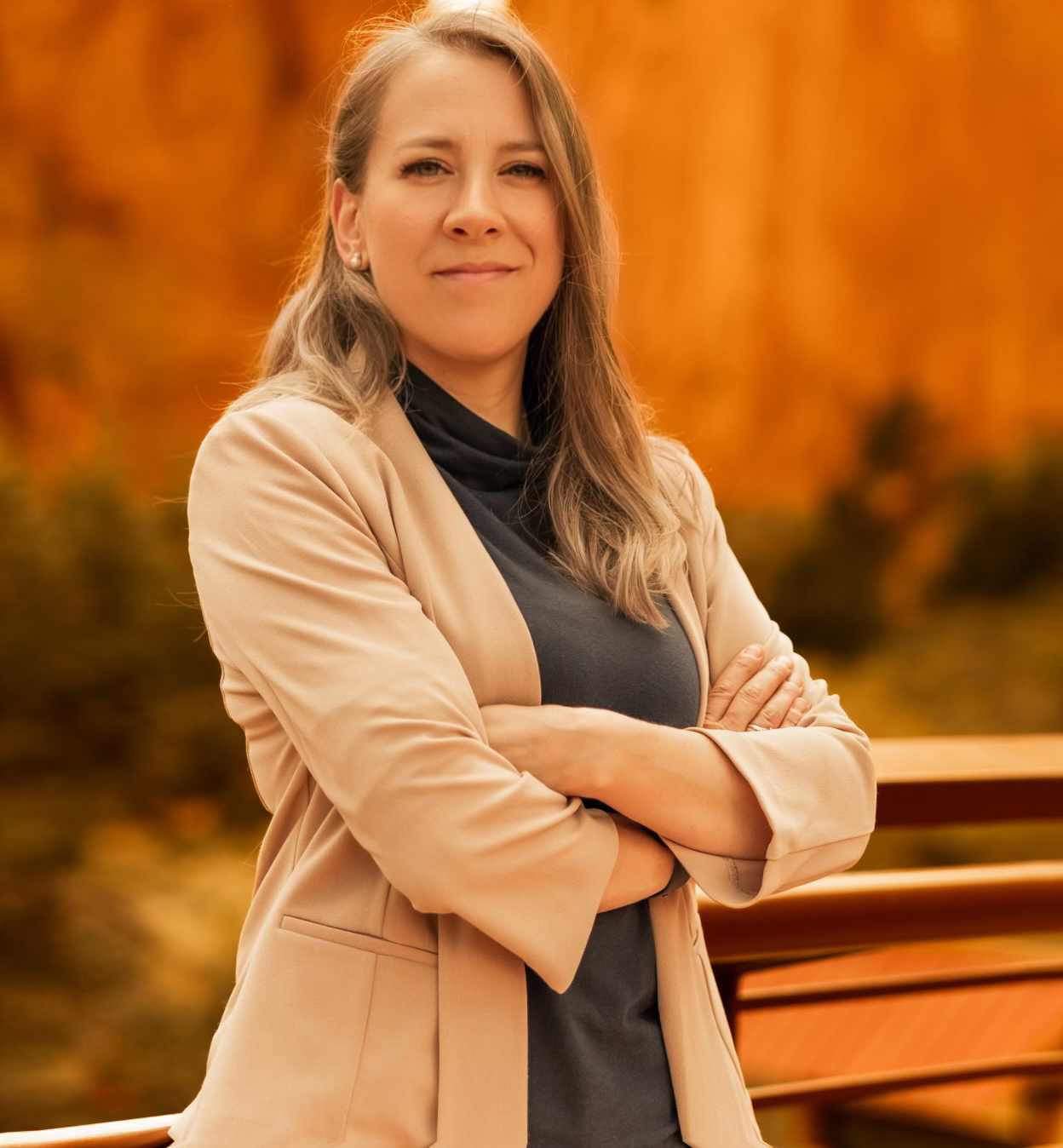 Natalia Helmsing standing outdoors with arms crossed