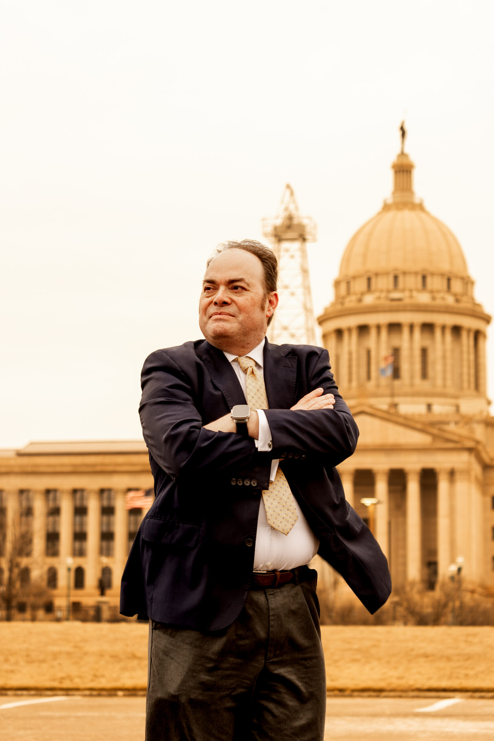 Robert Newark standing outdoors with the capitol building in the background