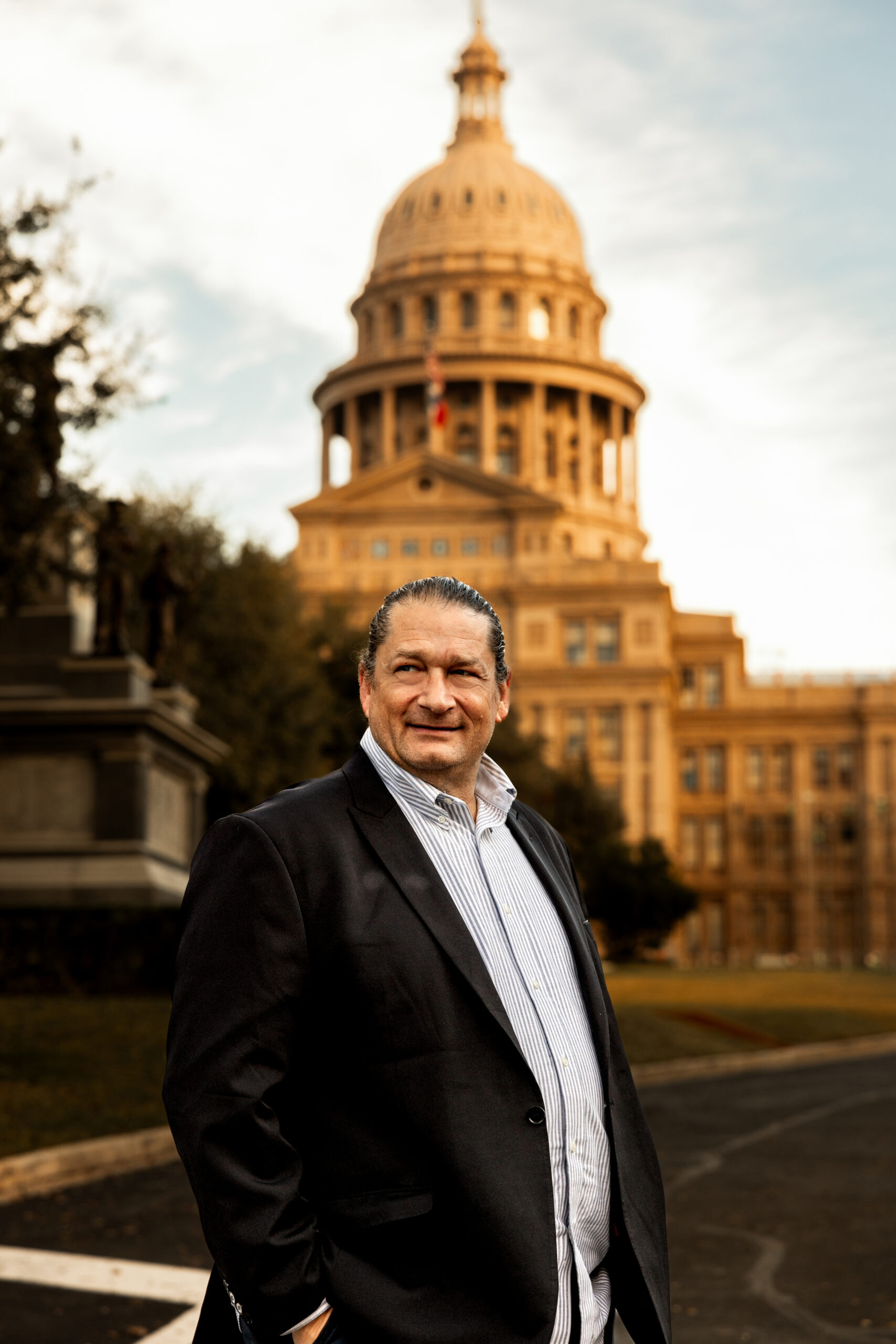 Will M. Helixon, Founder of the LOWMH, standing in front of the Texas State Capitol building