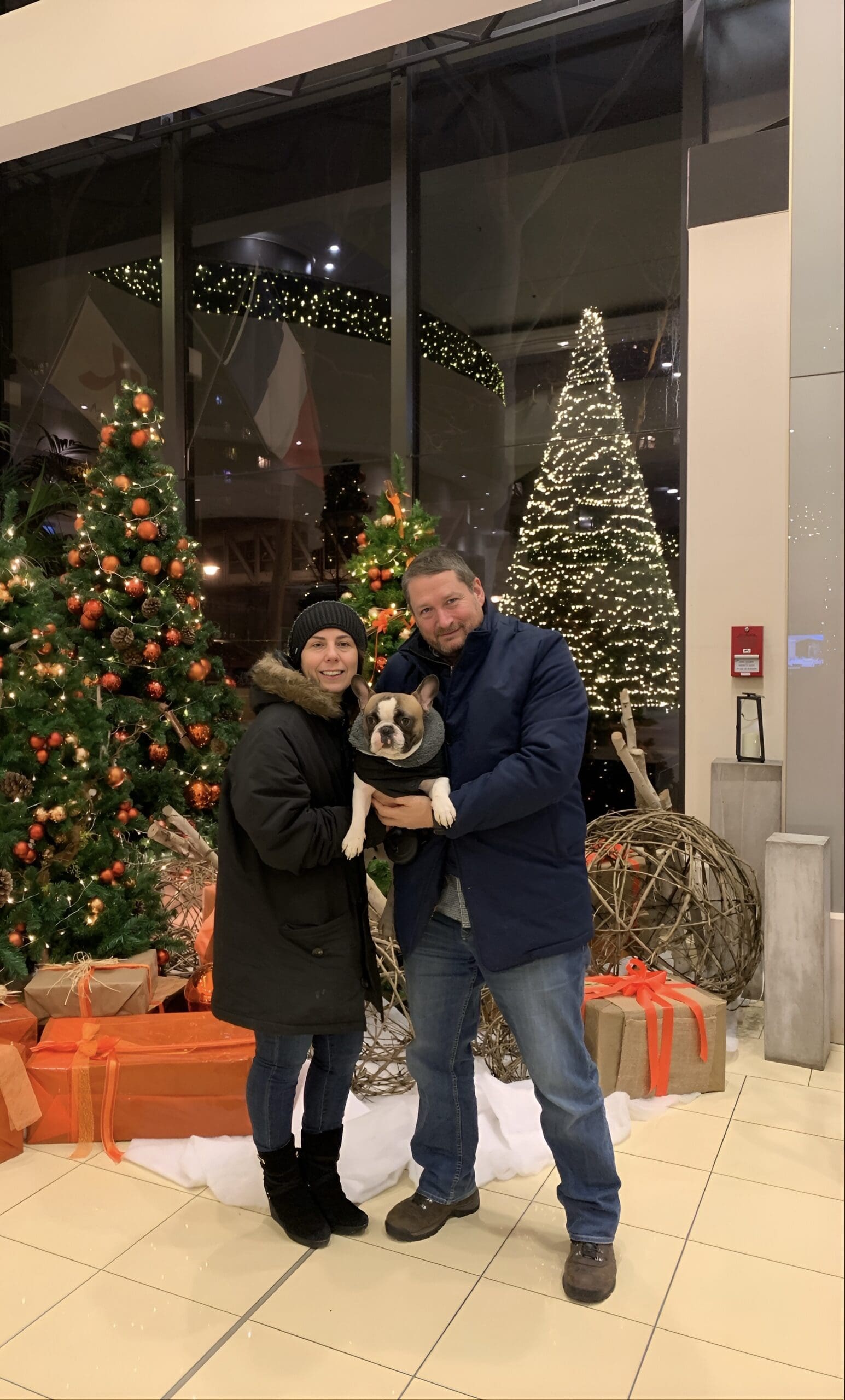 Will M. Helixon, Founder of the Law Office of Will M. Helixon, with family and dog in front of Christmas trees