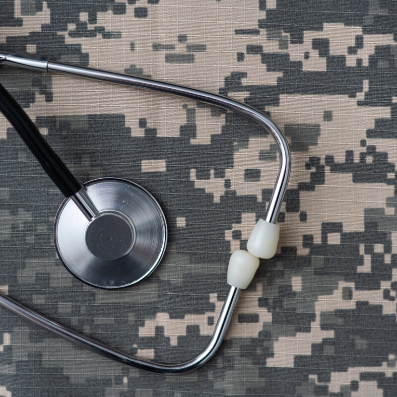 Stethoscope on US military uniform symbolizing veteran medical evaluations and disability health assessments