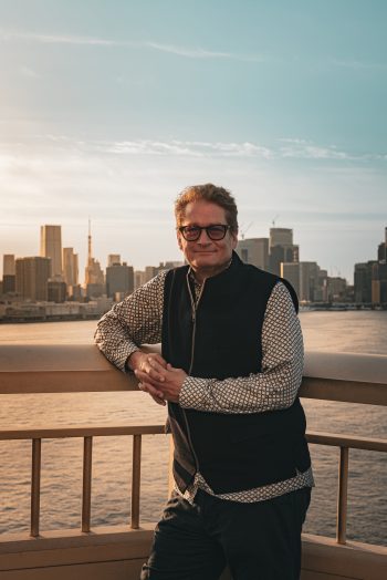 Court-martial attorney Will M. Helixon at the Rainbow Bridge railing, Tokyo Bay